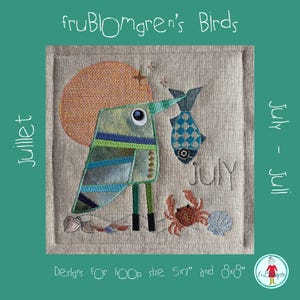 May include: An embroidery design on beige fabric featuring a green bird with a large orange sun, a blue patterned fish, a crab, and seashells. The text reads fruBLOmgren's Birds, juillet, July - Juli, july, and Designs for hoop size 5x7" and 8x8".