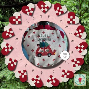 May include: A white apron with a red and green Christmas design featuring a car with a Christmas tree on top. The text "holly jolly christmas" is embroidered on the apron. The apron is surrounded by a circle of red and white hearts with the words "we love december" written around the circle. The hoop size is 5x7 inches.