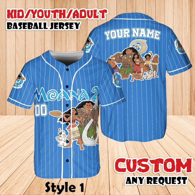 May include: A blue baseball jersey with white pinstripes, featuring characters from the movie "Moana." The front displays "Moana 2" and the number "00." The back has "YOUR NAME" above a character graphic. Text at the top reads "KID/YOUTH/ADULT BASEBALL JERSEY."