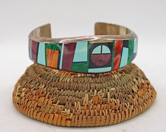 Pulsera de plata esterlina con incrustaciones de piedras múltiples y diseño navajo de Frank Yellowhorse