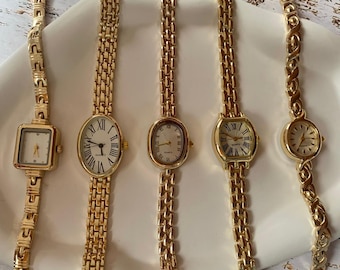 Orologio da donna vintage con bracciale in oro, quadrante romano, stile minimalista ed elegante.