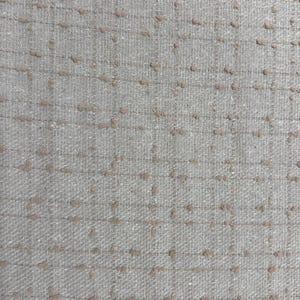 May include: A light gray fabric featuring a grid pattern formed by thin, darker gray lines. The intersection points of the grid are accented with small, raised, textured tufts of light brown thread, creating a subtle, tactile, and repeating design.