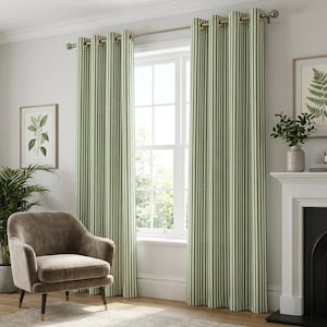 May include: Green and white striped curtains hang in front of a window. The curtains are made of a thick fabric and have metal grommets. A brown armchair sits in front of the curtains. A framed botanical print hangs on the wall.