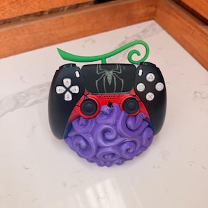 May include: A set of three ceramic mugs with a speckled, cream-colored glaze. Each mug features a different hand-painted floral design in shades of blue, green, and yellow. The mugs have a simple, rounded shape and a comfortable handle.