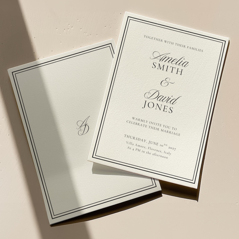 Black and white wedding invitation flat lay showing coordinated stationery set