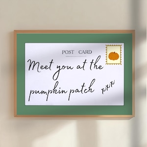 May include: A framed print featuring a postcard design with a white background, green border, and a postage stamp showing an orange pumpkin. The text reads POST CARD and Meet you at the pumpkin patch xxx in black cursive and print lettering.