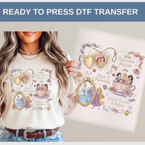 May include: A cream-colored t-shirt featuring a DTF transfer design with the text "Princesses Forever." The design includes illustrations of princesses, a heart-shaped locket, and a teacup. The words "Magic & Friendship" and "Dream, Imagine & Believe" are also present.