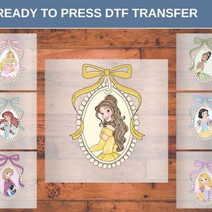 May include: DTF transfer sheets featuring cartoon illustrations of princesses in oval frames with bows. The princesses are depicted in various colors, including yellow, pink, blue, and purple. The text "READY TO PRESS DTF TRANSFER" is at the top.