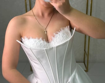 Elegant wedding dress with a corset top and a full skirt