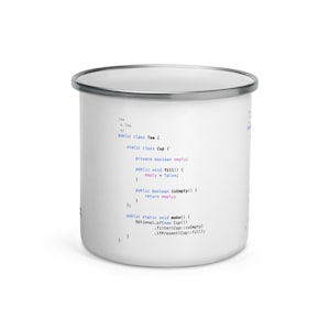 May include: White enamel mug with a silver rim. The mug features a code snippet about tea, including lines like "public class Tea" and "static class Cup". The text is in blue and black.