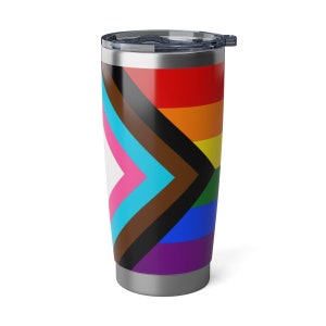 May include: A stainless steel tumbler with a black lid and a colorful Pride flag design. The flag features a rainbow pattern with additional chevrons in pink, light blue, brown, and black. The tumbler is cylindrical and has a silver base.