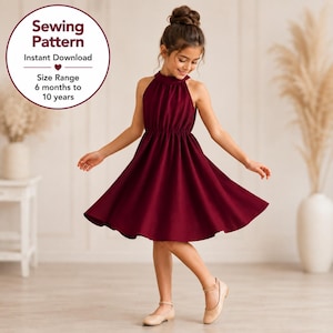 May include: A sewing pattern for a sleeveless dress in a deep burgundy color. The text on the image reads: Sewing Pattern, Instant Download, Size Range 6 months to 10 years. The dress features a high halter neckline, a gathered waist, and a flared skirt.