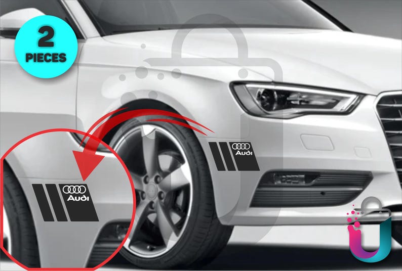 May include: Black and white Audi car decals. The decals feature the Audi logo and three vertical stripes. The image shows the decals applied to the front of a white car. The image also includes a blue circle with the text "2 PIECES".