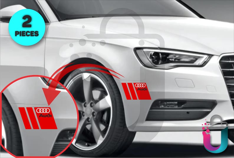 May include: Red and white Audi car decals. The decals feature the Audi logo and three vertical stripes on a red background. The image shows the decals applied to the front of a white car. The text "2 PIECES" is in a blue circle.