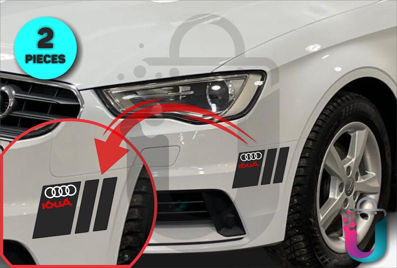 May include: Two black and red car decals with the Audi logo and text. The decals are rectangular with three vertical stripes. The decals are shown on a white car.