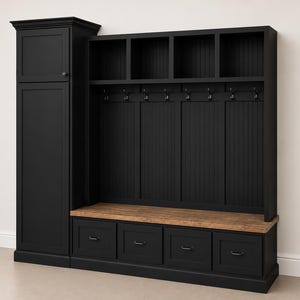 May include: A black wooden entryway organizer with a cabinet, open shelves, coat hooks, and drawers. The bench seat is made of light brown wood. The organizer is against a white wall.