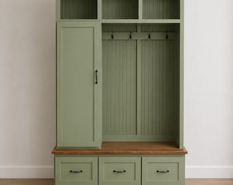 May include: A sage green entryway organizer with a cabinet, three drawers, and open shelves. The unit has a wooden bench and three hooks for hanging items. Black hardware accents the drawers and cabinet door.