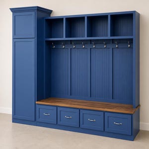 May include: A large, navy blue entryway storage unit with a tall cabinet, open shelves, coat hooks, and four drawers. The unit has a wooden bench and is against a neutral wall.