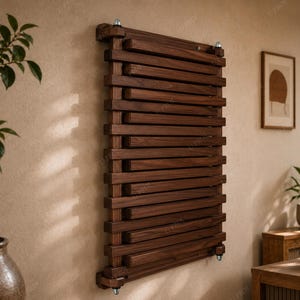 May include: A wall-mounted radiator featuring a series of horizontal dark brown wooden slats arranged in a grid pattern. The structure is secured with metallic hardware at the top and bottom corners, creating a linear and functional design element.