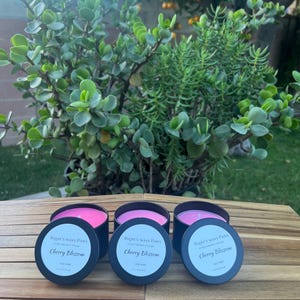 May include: A set of three ceramic mugs with a speckled, matte finish. Each mug features a different color: light blue, cream, and gray. The mugs have a simple, modern design, suitable for coffee or tea.