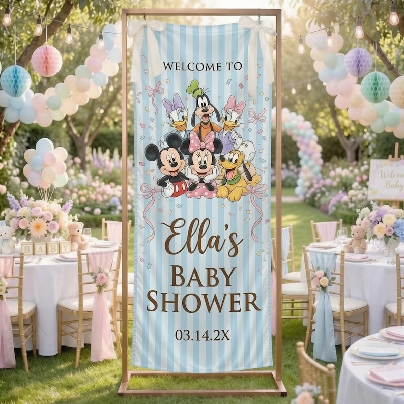 May include: A vertical light blue and white striped banner featuring cartoon characters Mickey Mouse, Minnie Mouse, Donald Duck, Daisy Duck, Goofy, and Pluto. The text reads WELCOME TO Ella's BABY SHOWER 03.14.2X. The banner is held by a metal frame.