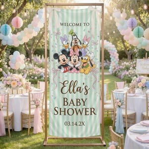 May include: A vertical banner with a light green and white striped background featuring Disney characters including Mickey, Minnie, Donald, Daisy, Goofy, and Pluto. The text reads WELCOME TO Ella's BABY SHOWER 03.14.2X with pink ribbon accents.