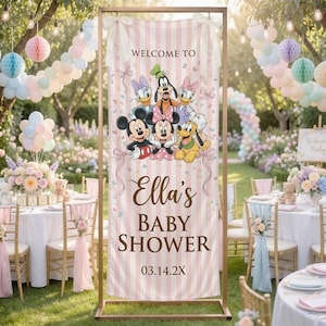 May include: A vertical banner with a light pink and white striped background featuring the text "WELCOME TO", "Ella's BABY SHOWER", and "03.14.2X". The design includes illustrations of Mickey Mouse, Minnie Mouse, Donald Duck, Daisy Duck, Goofy, and Pluto.