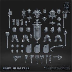 May include: A collection of gray miniature figurines and accessories, including weapons, armor pieces, and banners. The text "HEAVY METAL PACK" is displayed at the bottom. The Hydra Workshop logo is in the upper right corner.