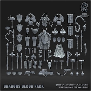 May include: A selection of grey miniature fantasy decor pieces, including shields, weapons, armour, and banners. The text "DRAGONS DECOR PACK" is at the bottom. The Hydra Workshop logo is in the upper right corner.