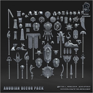 Könnte beinhalten: Eine Sammlung grauer Anubian-Dekorationsstücke, darunter Statuen, Waffen und architektonische Elemente. Die Stücke weisen komplizierte Details und altägyptische Designs auf. Der Text "ANUBIAN DECOR PACK" befindet sich am unteren Rand des Bildes.