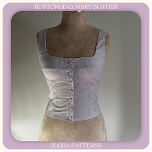May include: A light blue and white striped buttoned corset bustier with a square neckline. The top is fastened with buttons down the front. The text "BUTTONED CORSET BUSTIER" and "BUGRA PATTERNS" are visible.
