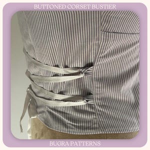 May include: A close-up of a grey and white striped corset bustier. It has ribbon ties and is labelled "BUTTONED CORSET BUSTIER" and "BUGRA PATTERNS".