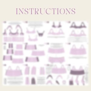 May include: A light purple instruction sheet with the word "INSTRUCTIONS" at the top. The sheet contains diagrams of sewing patterns for lingerie, with various bra and underwear designs. The background is a light beige color.