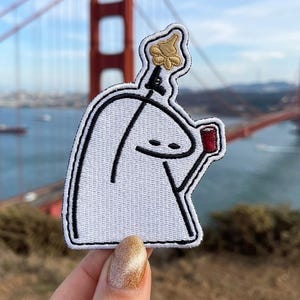 May include: A white ceramic mug with a black handle and the text "But First, Coffee" in a handwritten style. The mug is likely 11-15 ounces, perfect for a morning beverage.