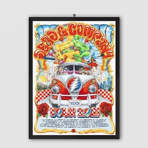 May include: A framed poster featuring a colorful illustration of a vintage VW bus with a Grateful Dead logo on the front. The poster has the text "Dead & Company" and "Truckin' Tour 2021" with a list of tour dates. The artwork includes cartoon characters and psychedelic imagery.