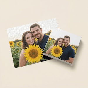 May include: A custom photo puzzle and a photo block featuring a couple in a sunflower field. The puzzle is white with a photo of the couple and sunflowers. The photo block shows the couple with a sunflower.