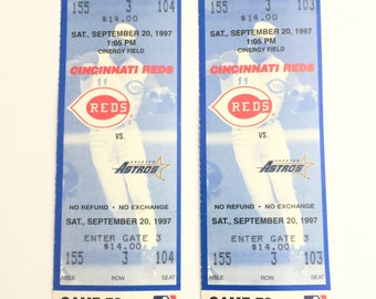May include: Two blue and white baseball tickets for the Cincinnati Reds vs. the Houston Astros game on September 20, 1997 at Cinergy Field. The tickets are for seats in row 3, seats 104 and 103, and cost $14.00 each.