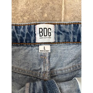 BDG Urban Outfitters Distressed Denim Mini Skirt Medium Wash Raw Hem Womens L image 2