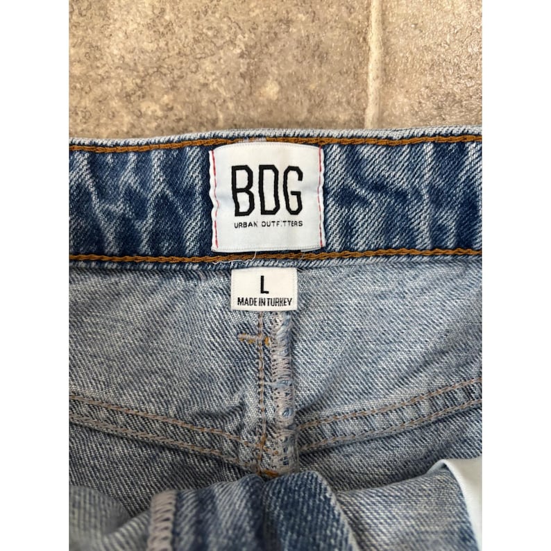 BDG Urban Outfitters Distressed Denim Mini Skirt Medium Wash Raw Hem Womens L image 2
