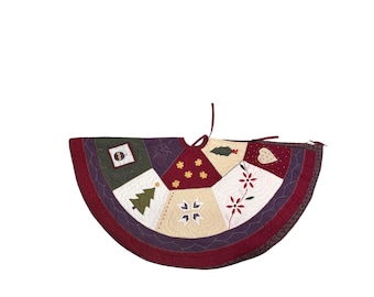 Saia para árvore de Natal em patchwork acolchoado com apliques, estilo rústico natalino, da Pottery Barn.