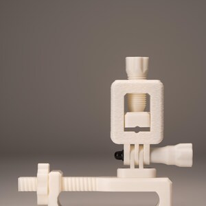 May include: A cream-colored, 3D-printed clamp with a screw mechanism. The clamp features a rectangular frame, a threaded rod, and a handle. The design is minimalist and functional, suitable for holding objects.
