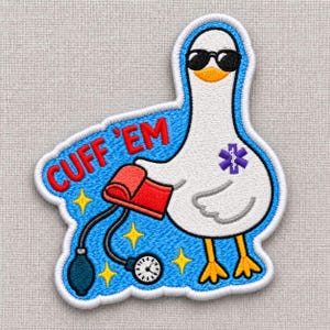 May include: An embroidered patch featuring a white goose wearing black sunglasses. The goose holds a red blood pressure cuff connected to a gauge and bulb. The blue background includes yellow stars and the red text CUFF EM with a purple medical symbol.