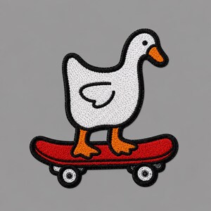 May include: An embroidered patch featuring a white goose with an orange beak and feet standing on a red skateboard. The design has a thick black border outlining the goose and the skateboard, which includes two black wheels with white centers.