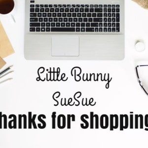 May include: A white desk with a laptop, stationery, and a cup of tea is shown from above. The text "Little Bunny SueSue Thanks for shopping!" is displayed in black.