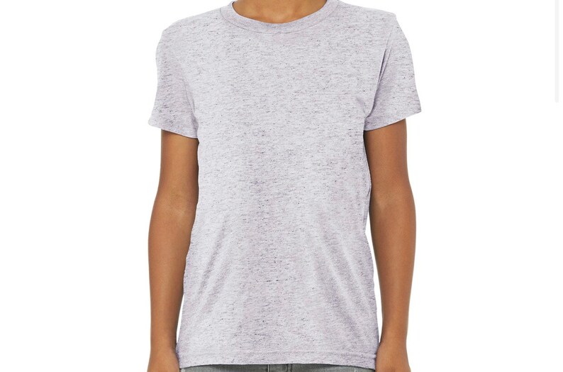 May include: A heather grey crew neck t-shirt. The short-sleeved shirt has a soft, textured appearance. The shirt is made of a lightweight material and is suitable for casual wear. The shirt is a solid colour with a subtle speckled pattern.