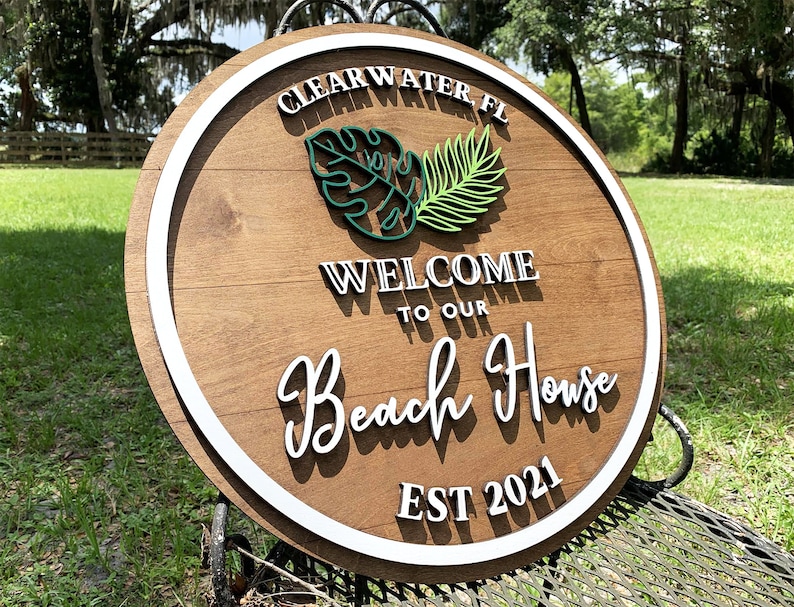 Custom wooden beach house sign with 3D lettering. Personalized wood beach house sign with your custom text, great for housewarming or closing gifts.