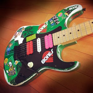 May include: A rustic wooden sign with the text "Welcome to our home" in white lettering. The sign has a distressed finish and a simple, inviting design, ideal for front door decor.