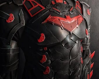 May include: Black and red superhero costume with a bat symbol on the chest. The costume features a high collar, armored plating, and red accents. The design includes a series of angular shapes and panels.