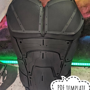 May include: Black chest armor with a detailed, futuristic design. The armor features mesh panels, riveted accents, and geometric shapes. The text "PDF TEMPLATE" is in a speech bubble. This item is likely for cosplay or costume use.