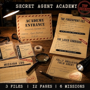 May include: A Secret Agent Academy kit featuring printed mission files, two ID badges labelled Shadow and Viper, a magnifying glass, a pencil, and a torch. The documents include titles like The Fingerprint File, The Laser Corridor, and Mission Log, with a Top Secret stamp and the text 3 Files, 12 Pages, 6 Missions.